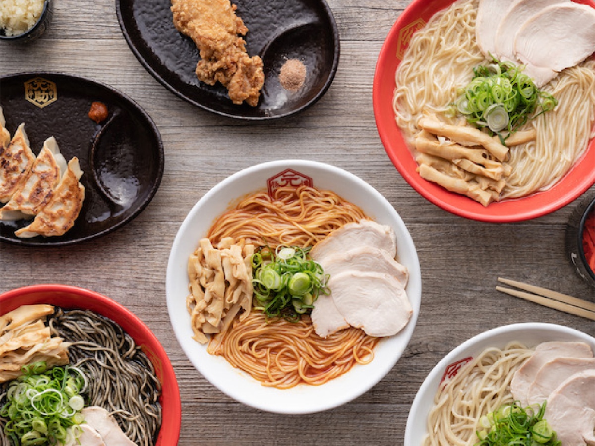 bowls of ramen and other side dishes