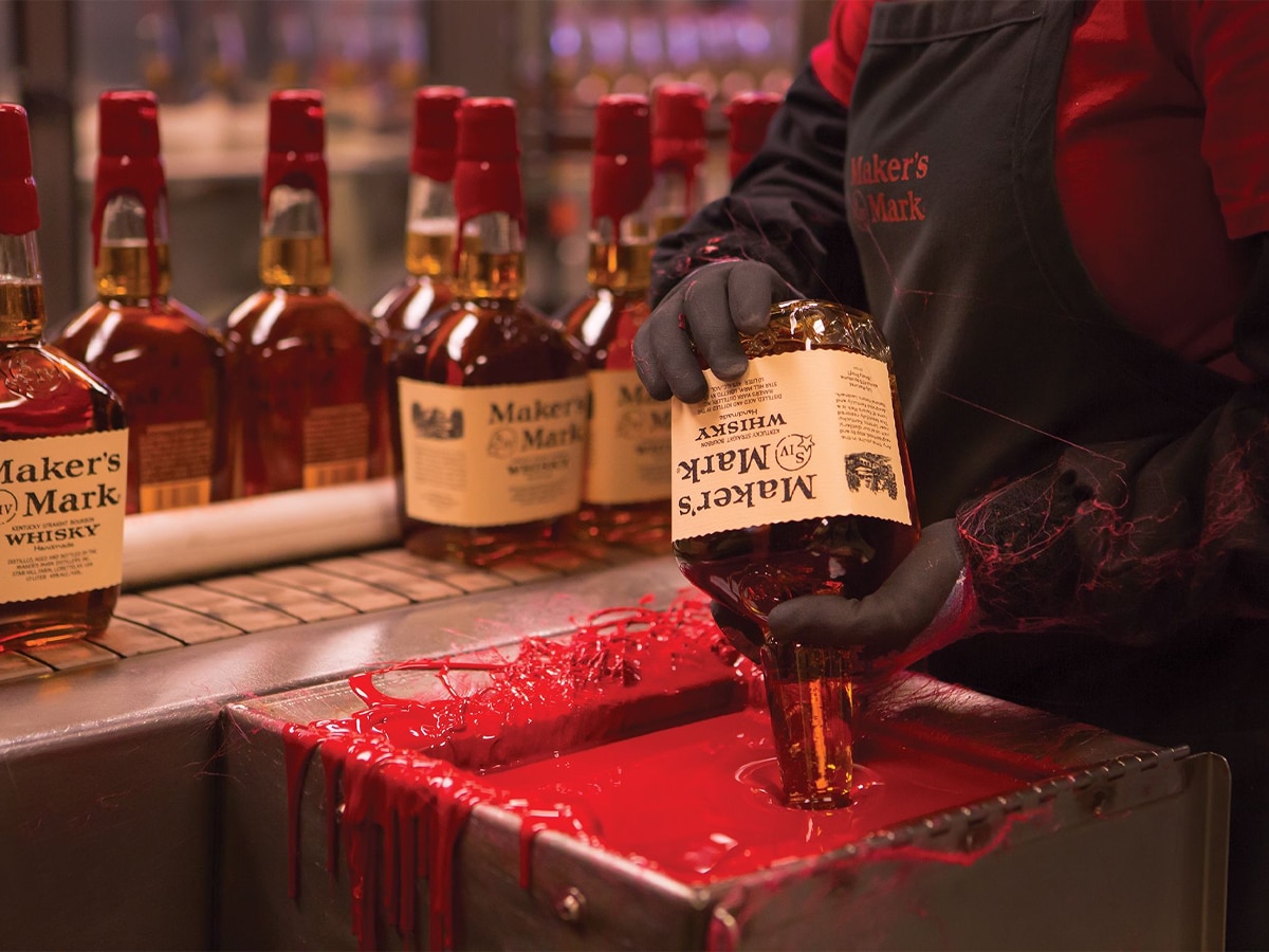 Producer putting the wax seal on Maker's Mark | Image: Maker's Mark