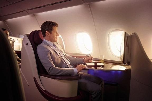 Man flying Business class