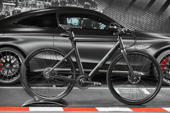 Side of Mercedes-Benz EQ Formula E Team eBike with side of car in background