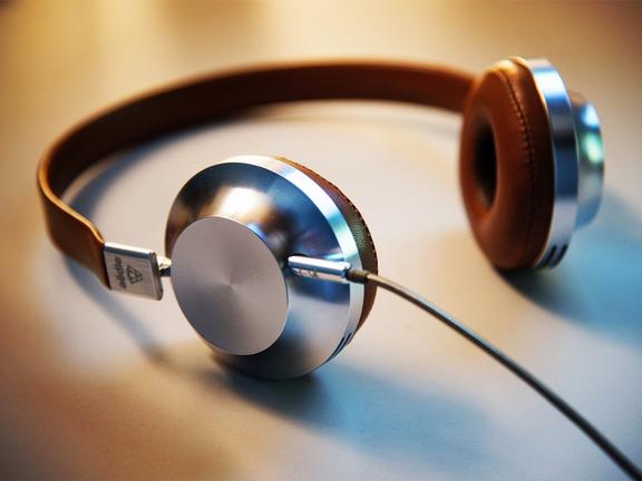 Close up of beige and silver coloured headphones