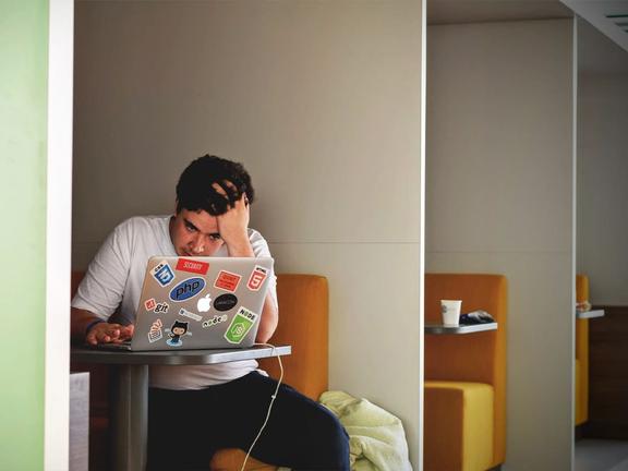 Stressed man at work | Image: Tim Gouw/Unsplash